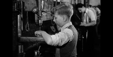 image of a child using a machine