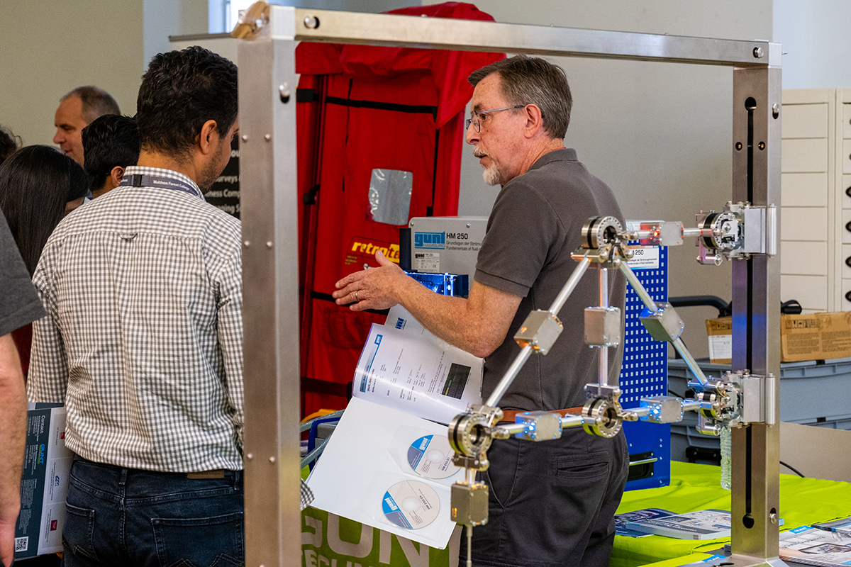 student speaks to engineer at Build Tomorrow event
