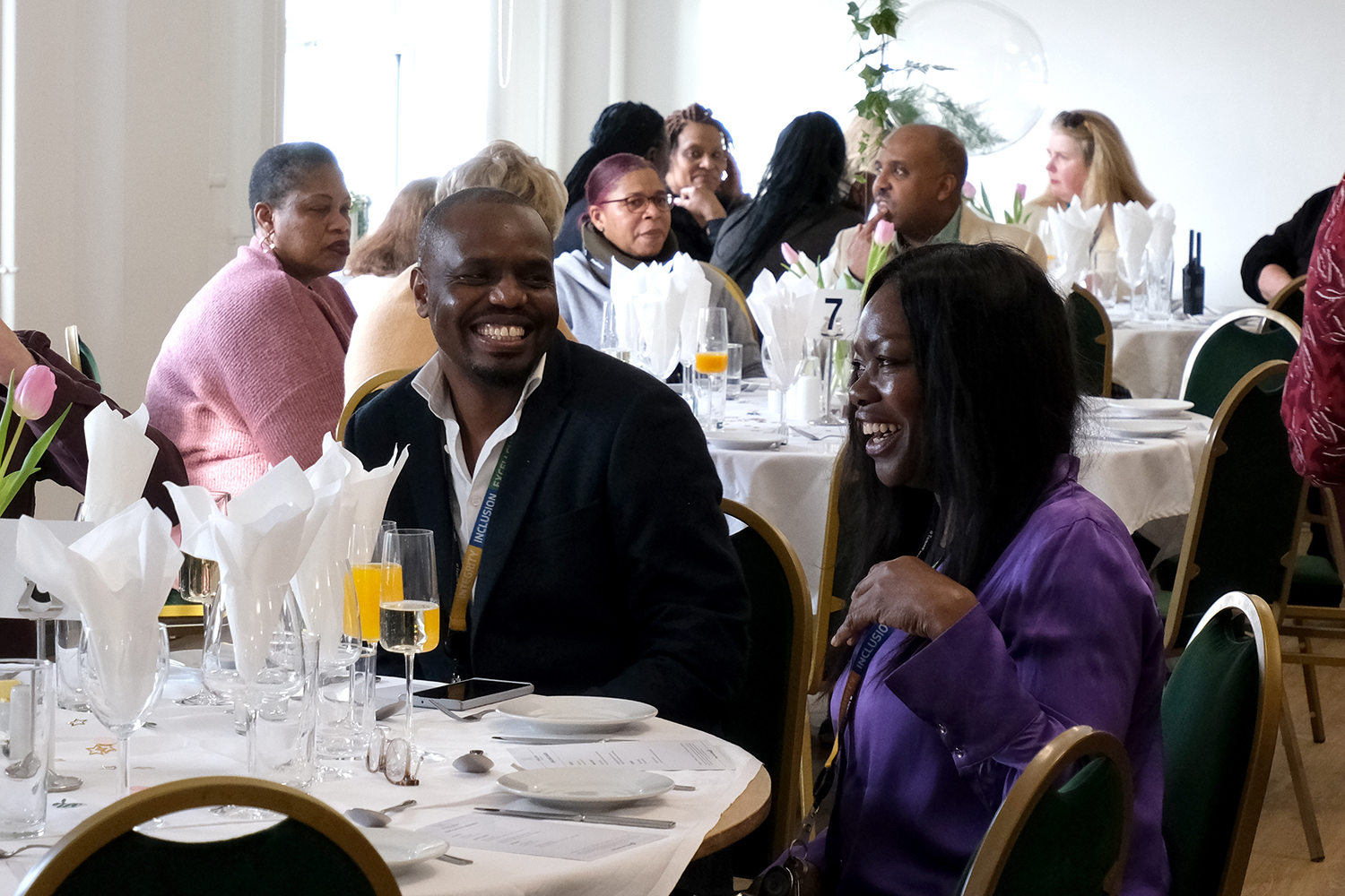 staff laughing at dining table