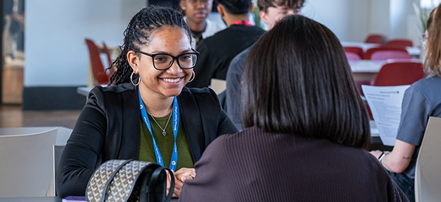 college's pillars against a blue sky