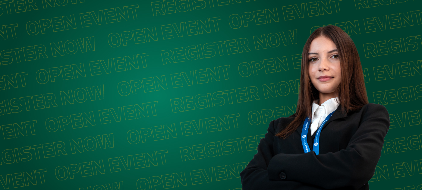 girl stands arms crossed in front of green background